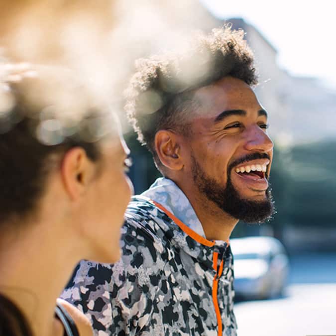 man smiling next to woman man smiling next to woman